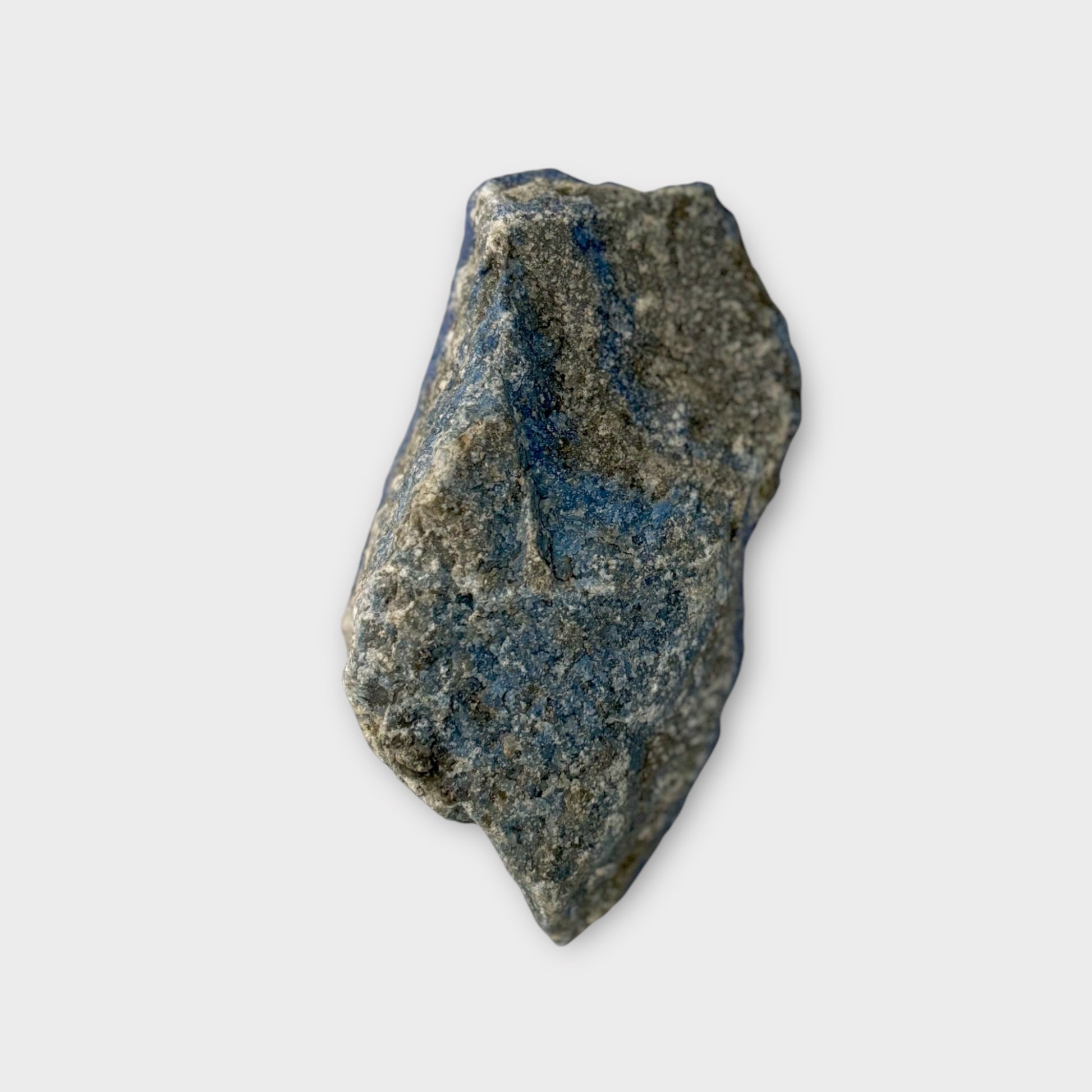 Back side of raw Lapis Lazuli slab with natural stone texture