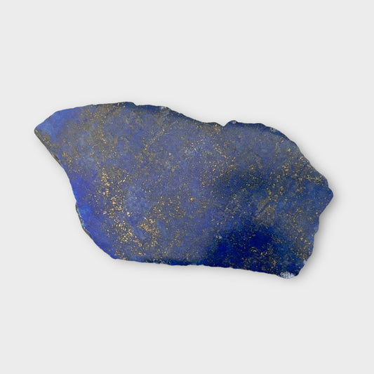 Polished Lapis Lazuli stone slab with deep blue color and golden flecks