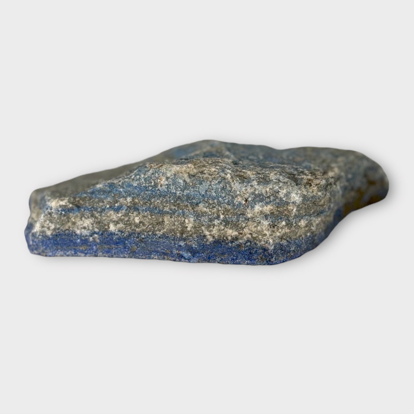 Side angle of Lapis Lazuli slab showing thickness and natural edges