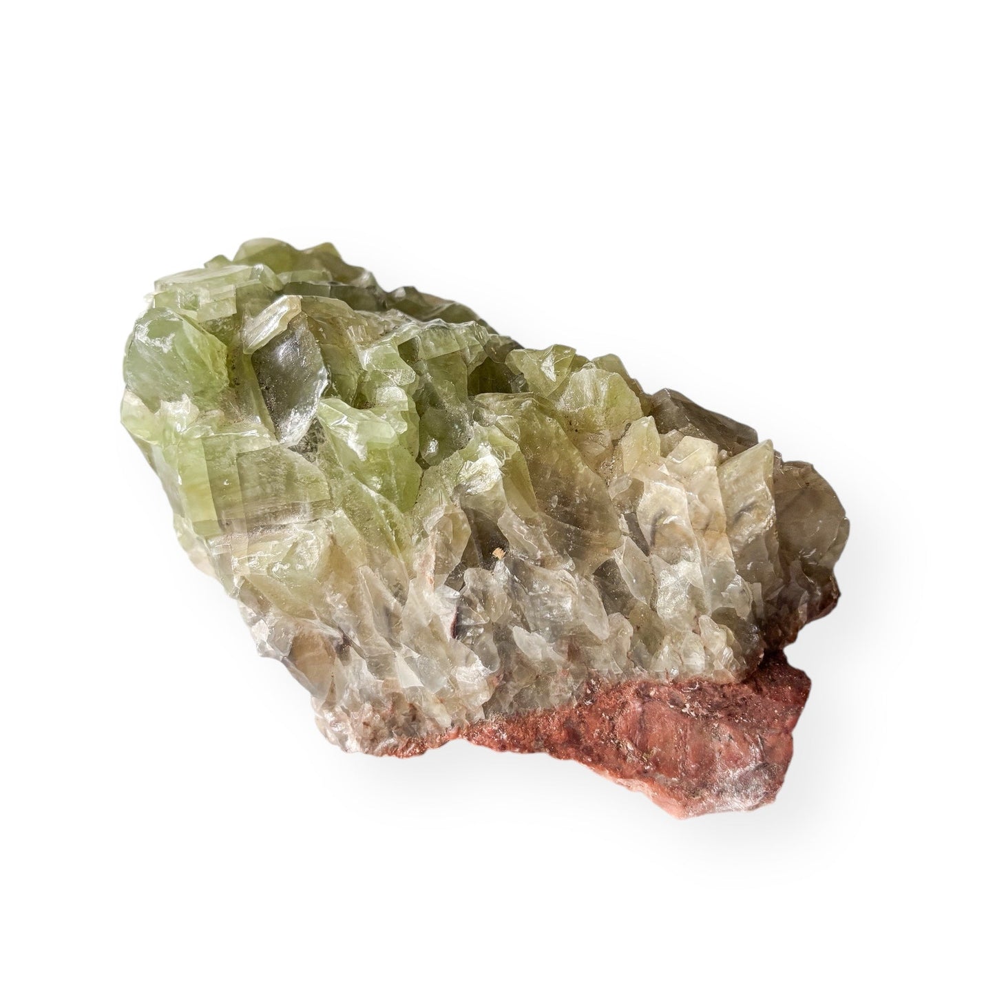 Raw Green Calcite crystal showing translucent texture and natural sparkle.