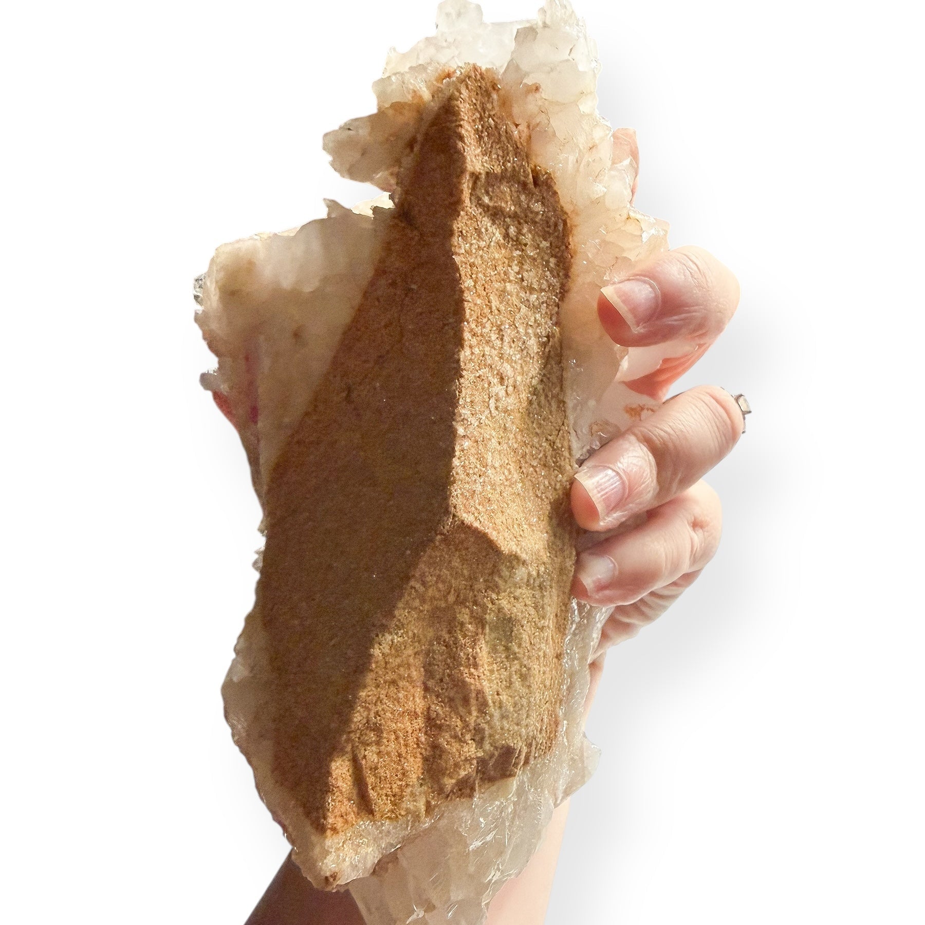 Back view of Large Quartz Cluster showing natural matrix base held in hand