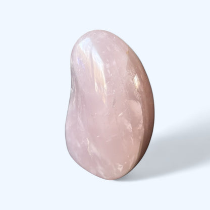 Side view of Lavender Rose Quartz crystal with polished curves and calming hue