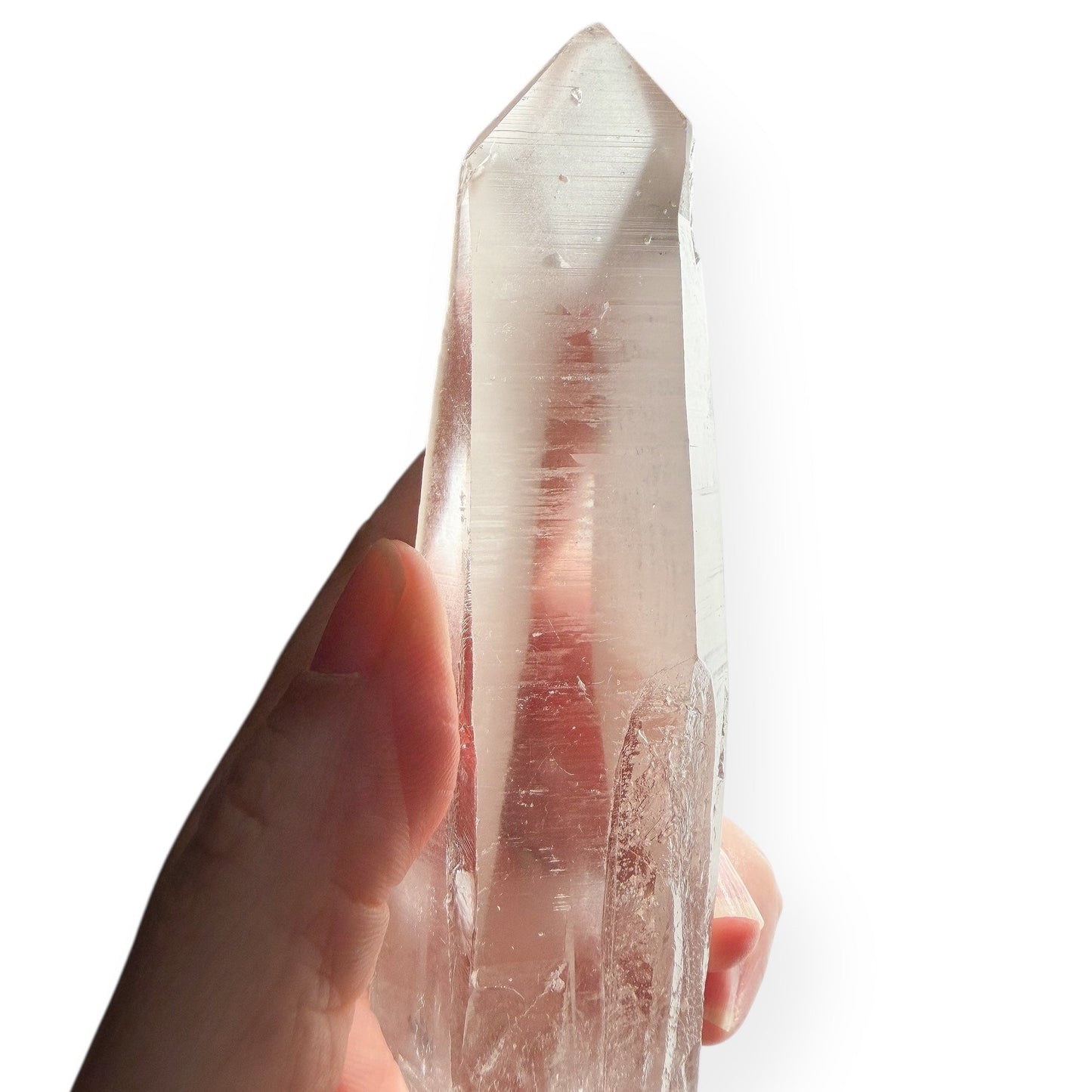 Lemurian Quartz Wand with visible record keeper triangles and striations on white background