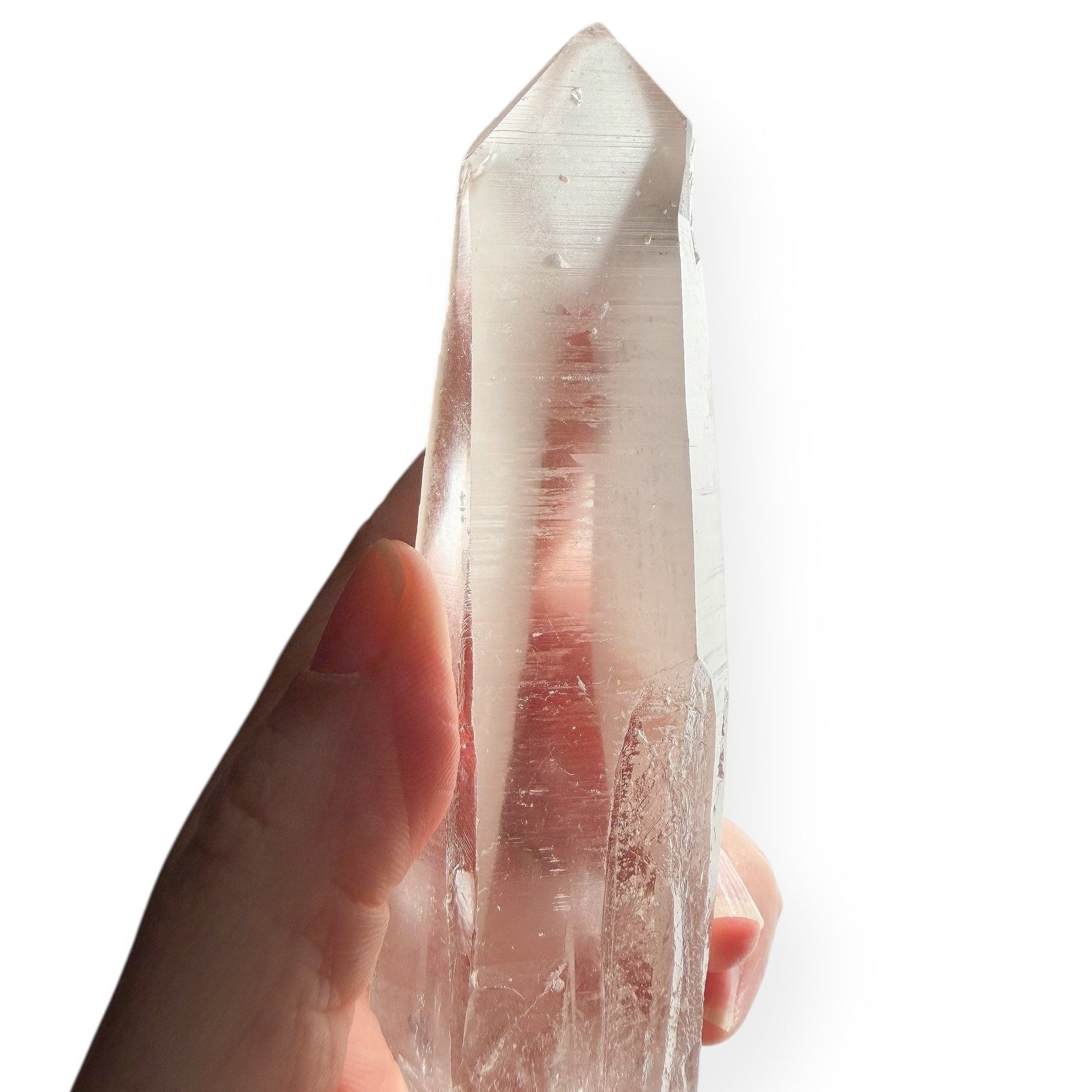 Lemurian Quartz Wand with visible record keeper triangles and striations on white background