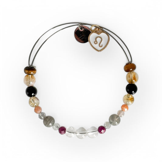 Leo Crystal Charm Bracelet with a white charm, handcrafted with Clear Quartz, Ruby, Labradorite, Sunstone, Citrine, Black Onyx, and Tiger’s Eye for confidence and passion.