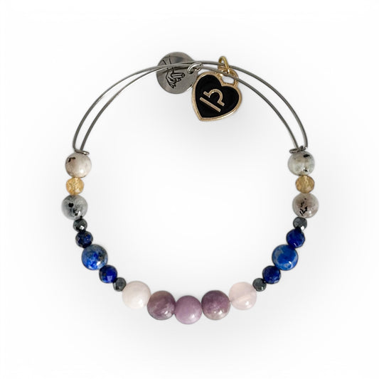 Libra Crystal Charm Bracelet with a black charm, featuring Lepidolite, Rose Quartz, Hematite, Lapis Lazuli, Moonstone, and Citrine for peace and intuition.