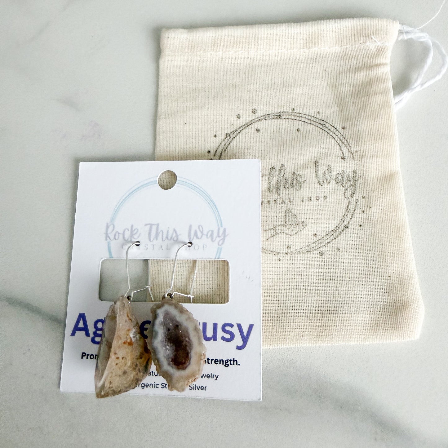 Light geode earrings packaged on Rock This Way Crystal Shop jewelry card