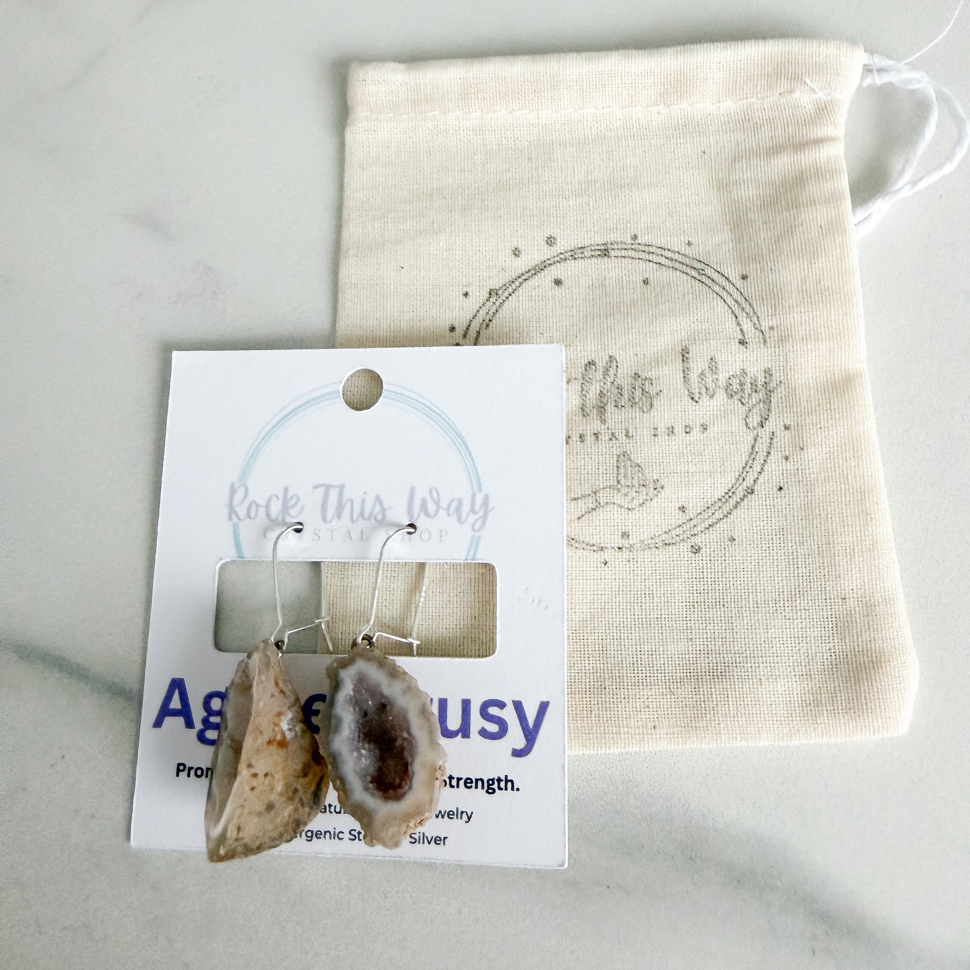 Light geode earrings packaged on Rock This Way Crystal Shop jewelry card