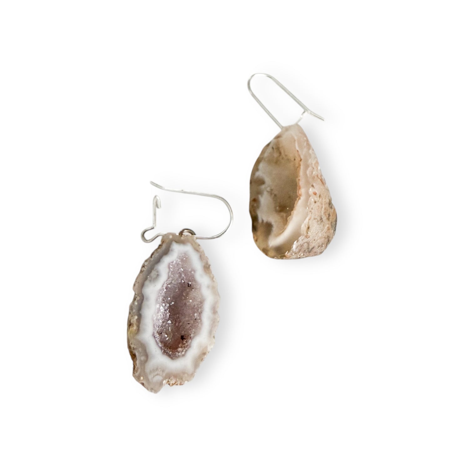 Light geode slice earrings with sterling silver kidney earring wires on white background