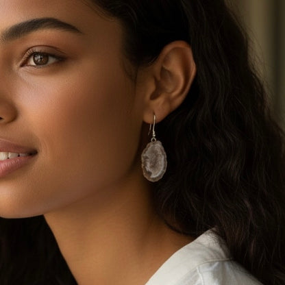 Model wearing light geode earrings with sterling silver kidney earring wires