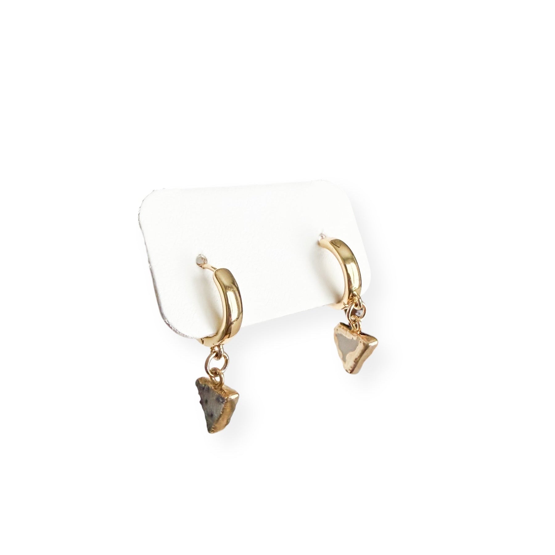 Close up of light triangle drusy crystal charms with natural sparkle on gold filled huggie earrings