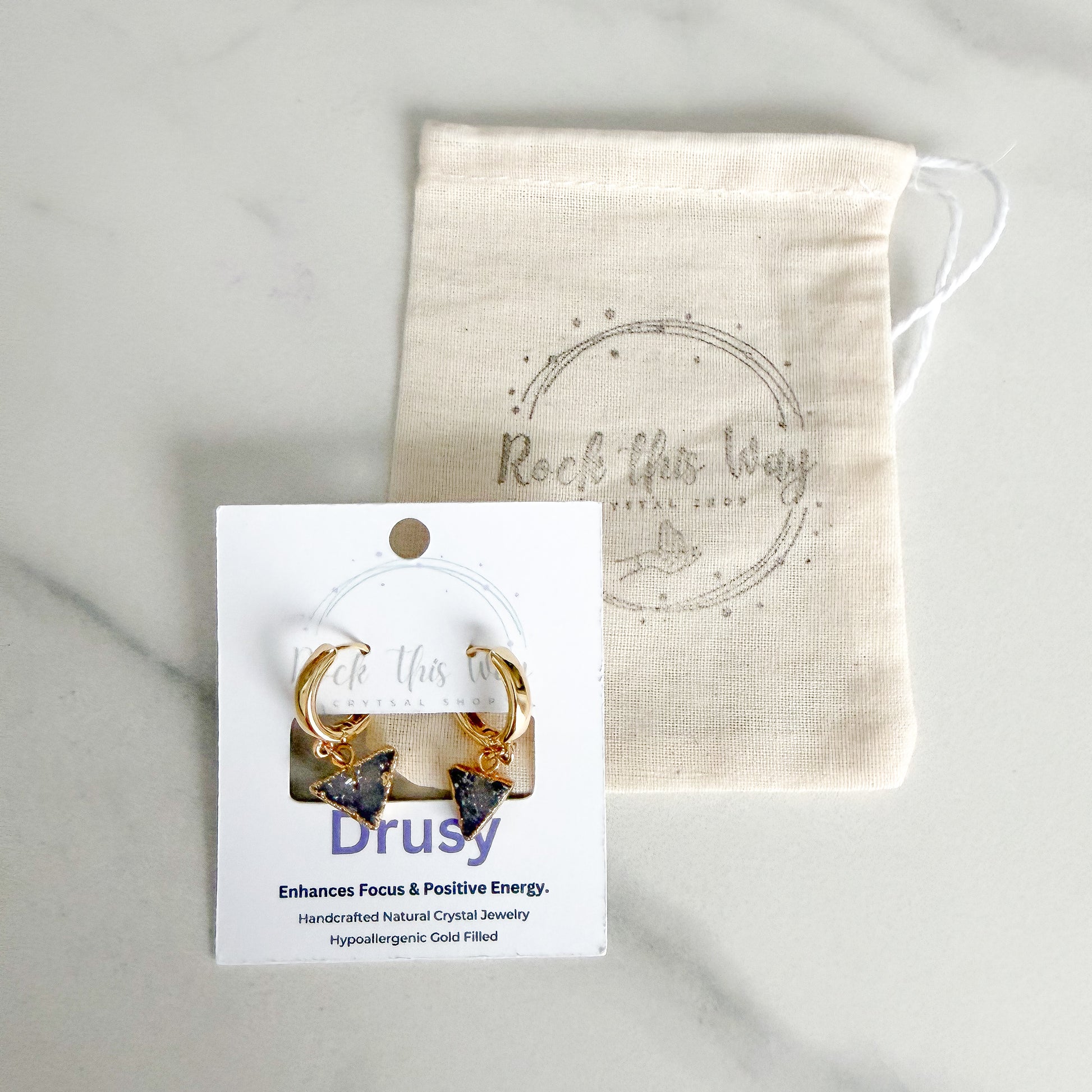 Light triangle drusy huggie earrings displayed on Rock This Way Crystal Shop packaging, ready for gifting