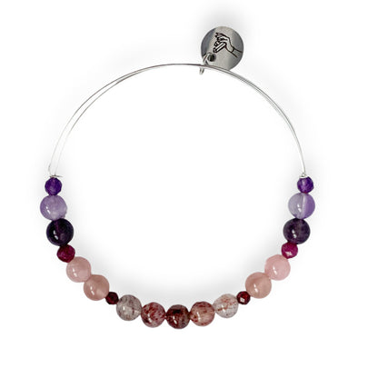 Love Crystal Charm Bracelet on pouch with pink and purple crystals and heart charm