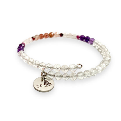 Micro-faceted Love Bracelet with Ruby, Rose Quartz, and Clear Quartz on white background