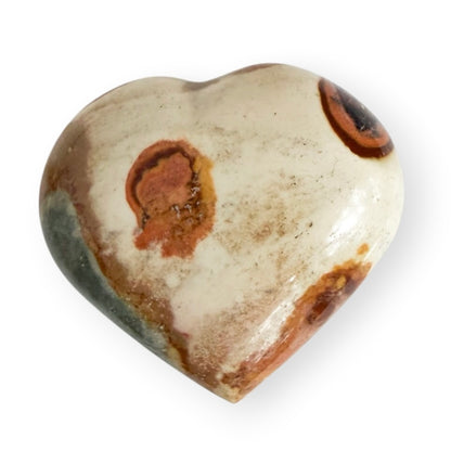 Polished Madagascar Ocean Jasper heart featuring cream, rust, and brown orbicular patterns.