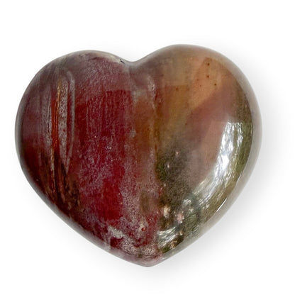 Polished Madagascar Petrified Wood heart with rich red, burgundy, brown, and cream natural coloring.