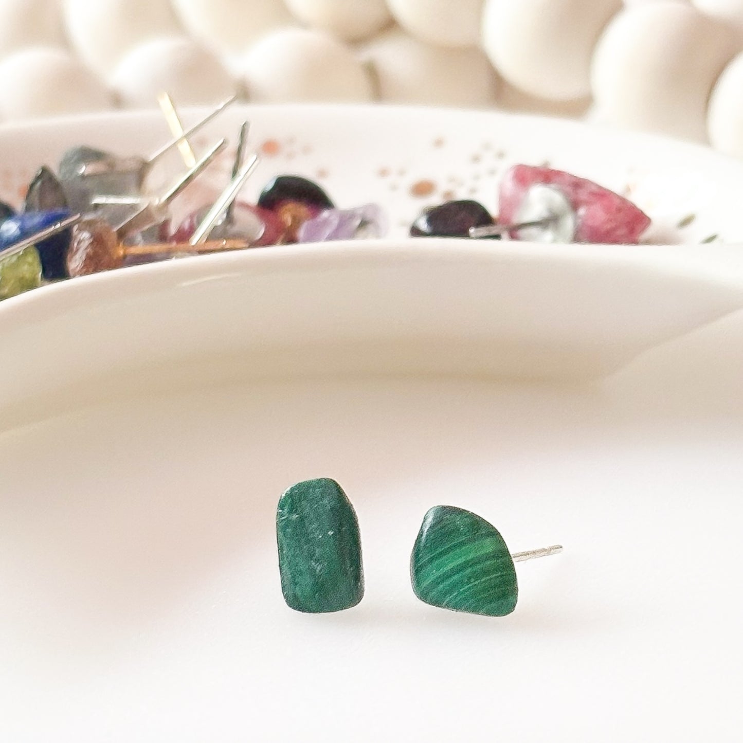 Side angle of Malachite earrings showing deep green color and natural swirls