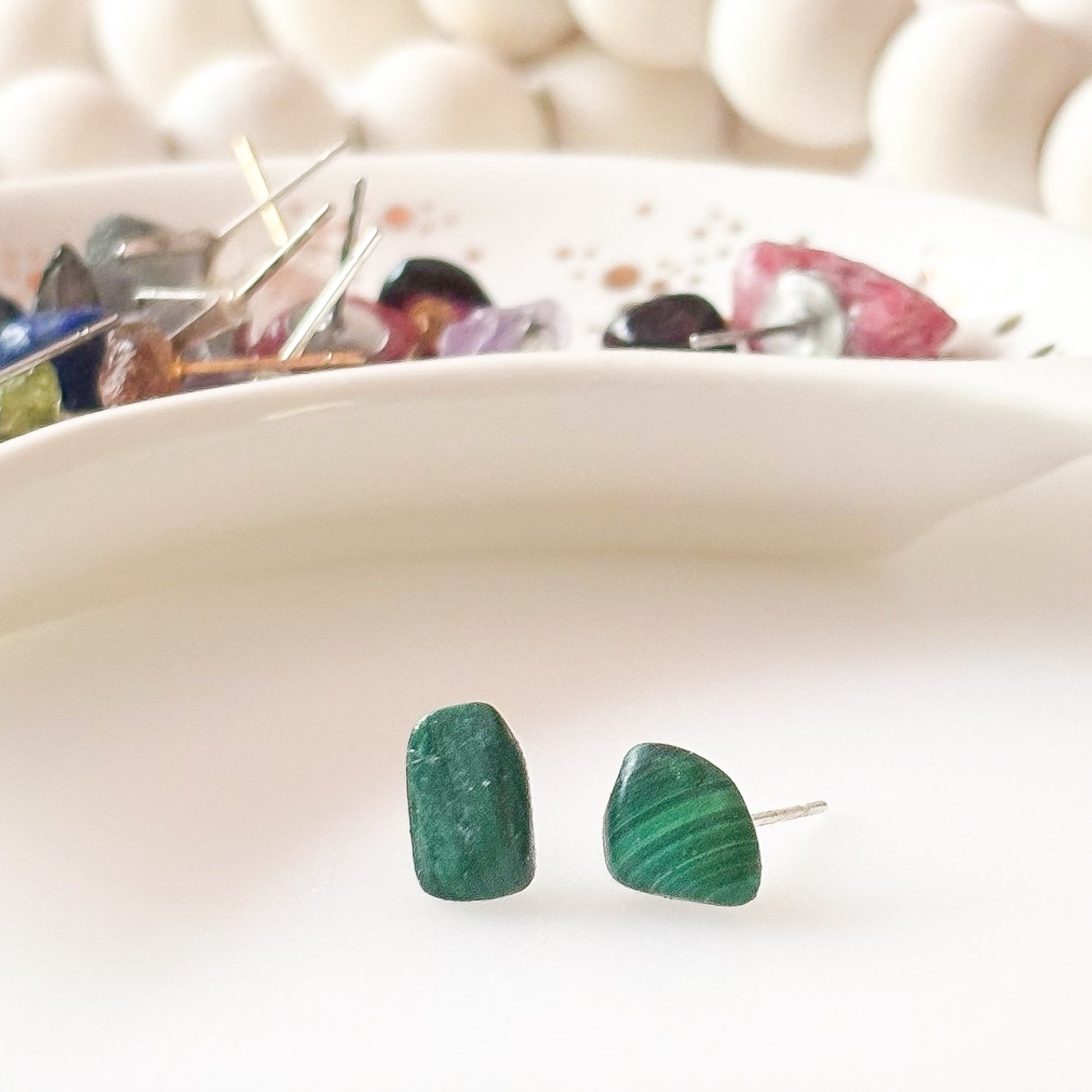 Side angle of Malachite earrings showing deep green color and natural swirls
