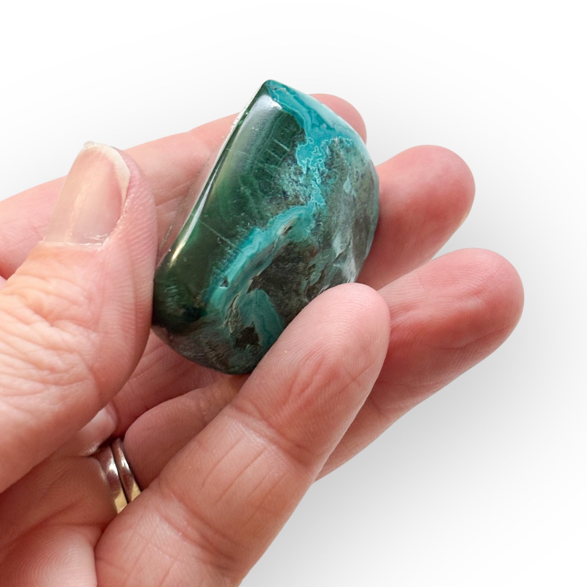 Side view of Malacolla Polished Stone showing mixed green hues