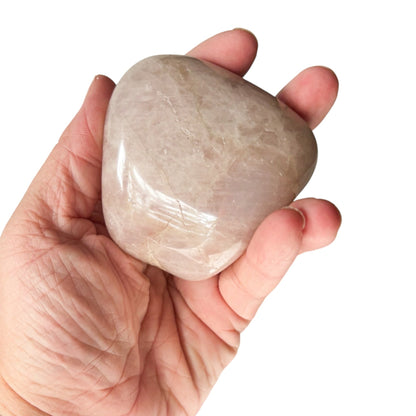 Medium Rose Quartz palm stone with natural polish and gentle color.
