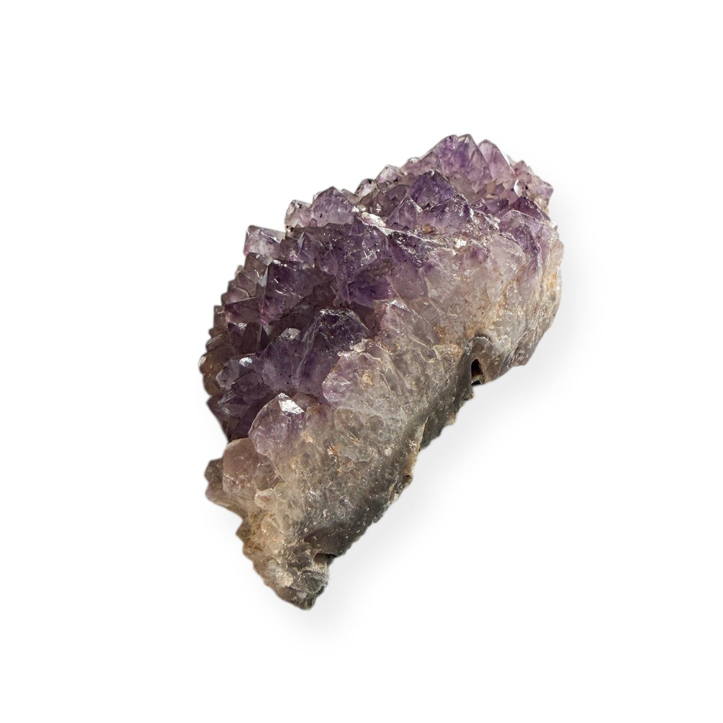 Back view showing green matrix of amethyst cluster in hand