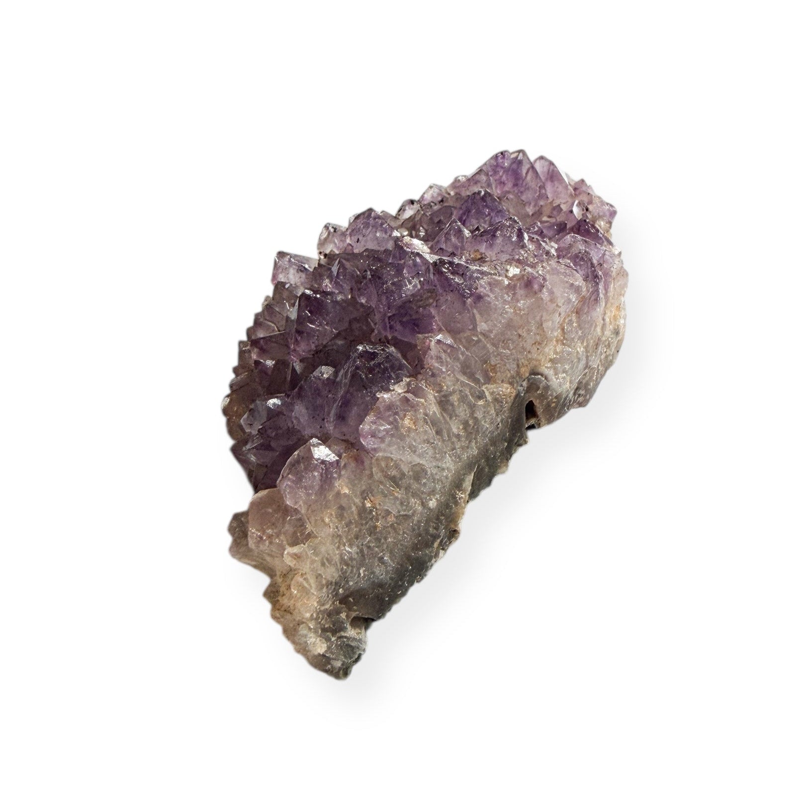 Back view showing green matrix of amethyst cluster in hand