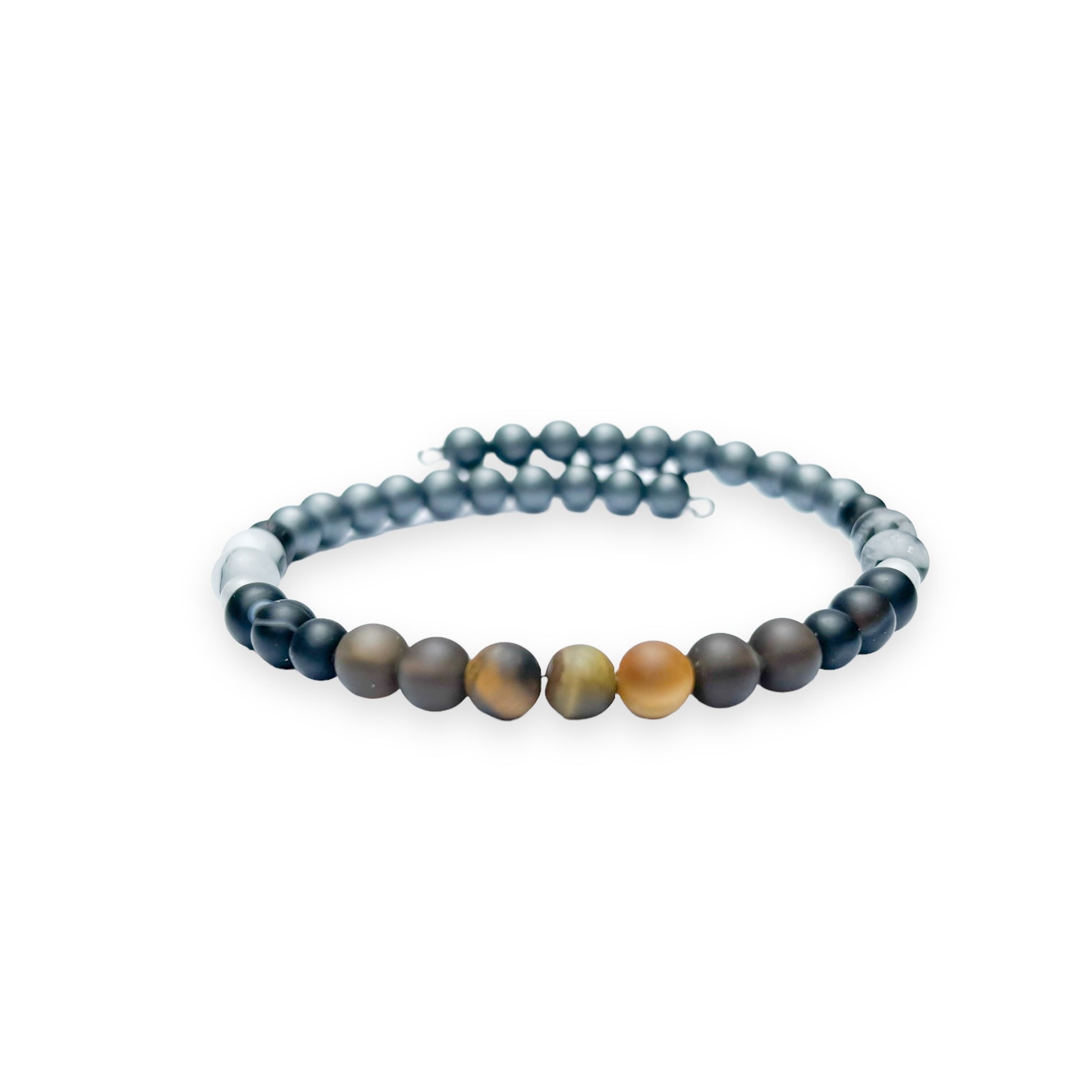 Top view of Men’s Protection Bracelet with Tiger’s Eye, Hematite, and Tourmaline in Quartz