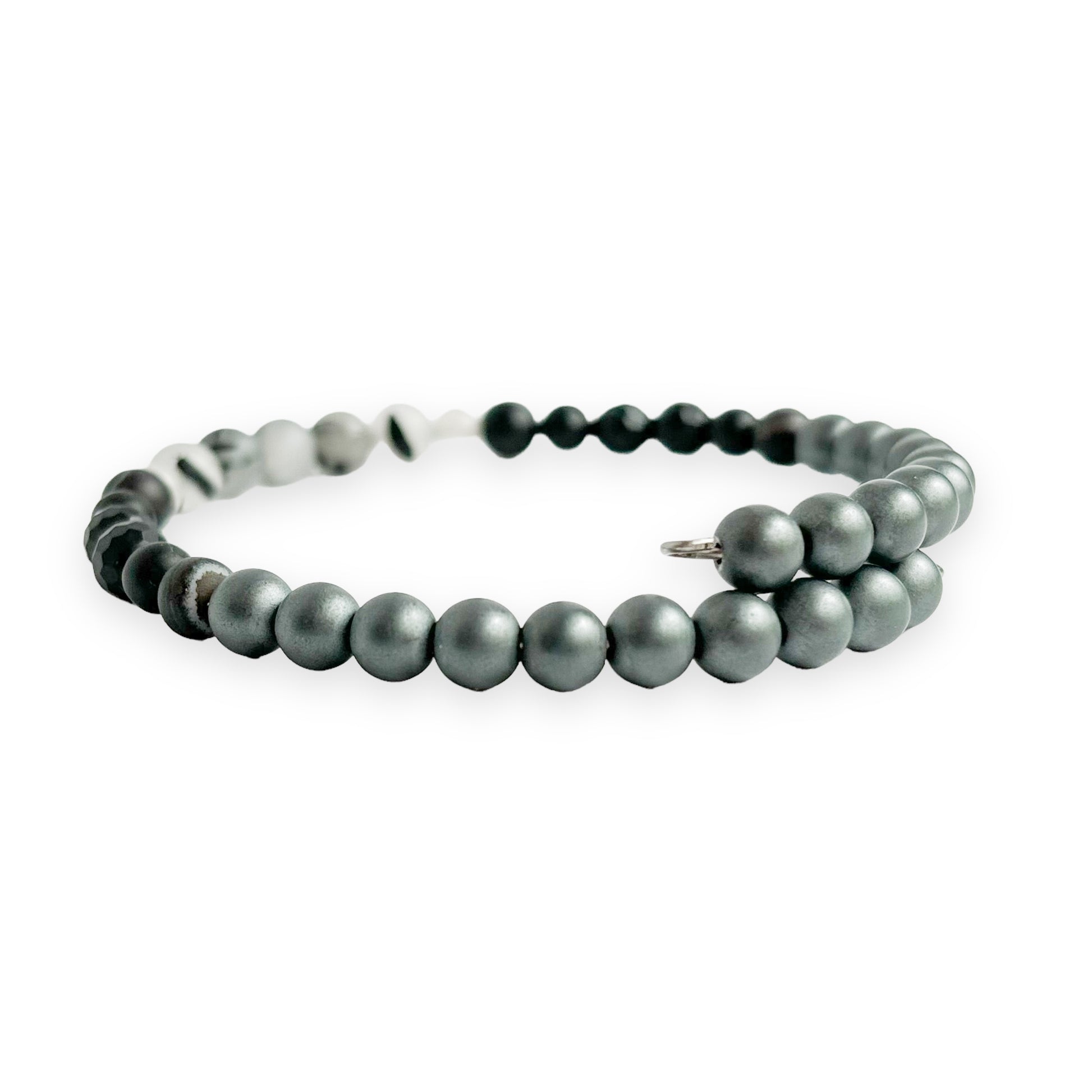 Side view of unisex strength bracelet on stainless steel band