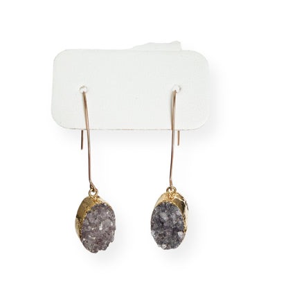 Close up of oval smoky gray drusy crystal earrings highlighting natural crystal texture and sparkle