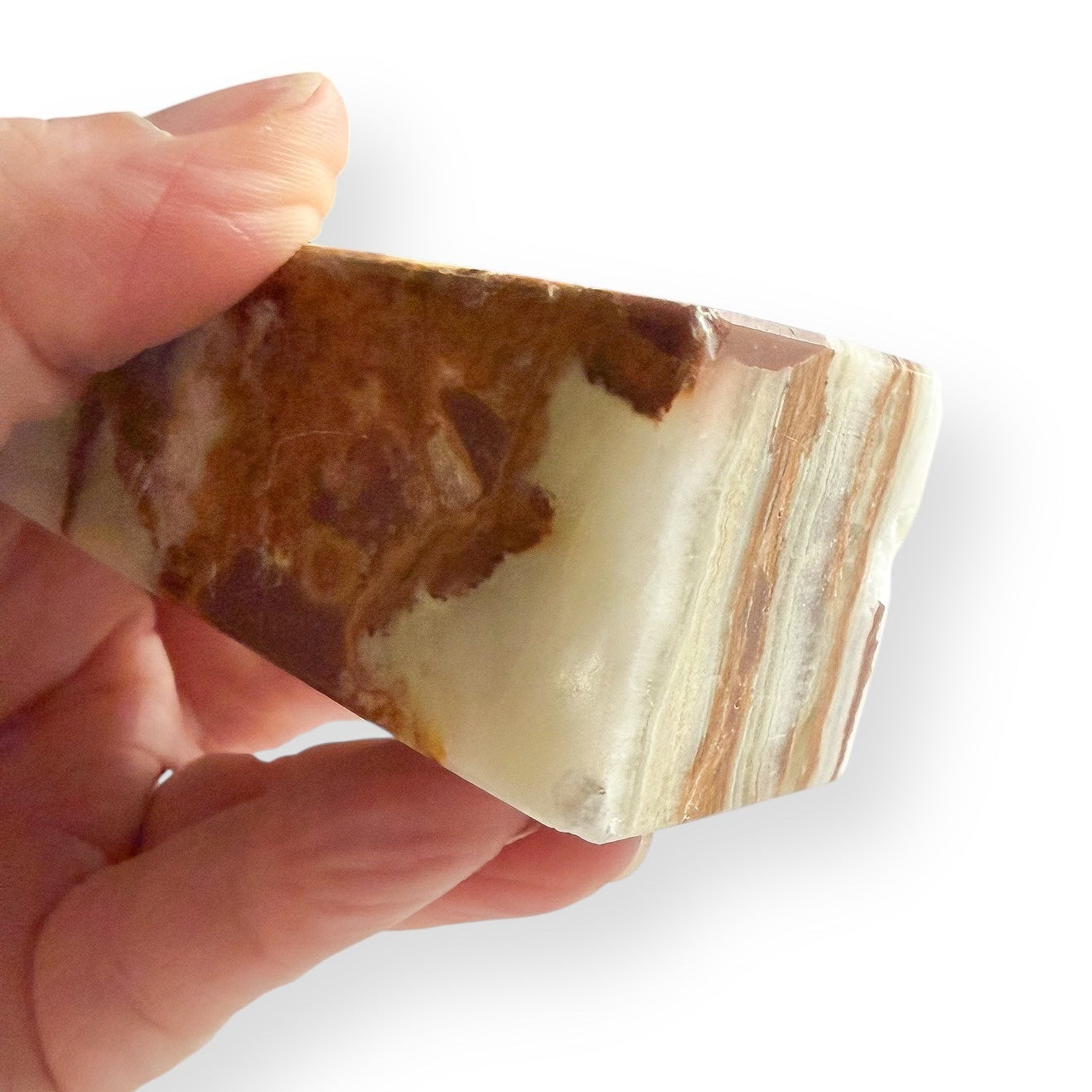 Pakistani Onyx Obelisk shown in hand for scale