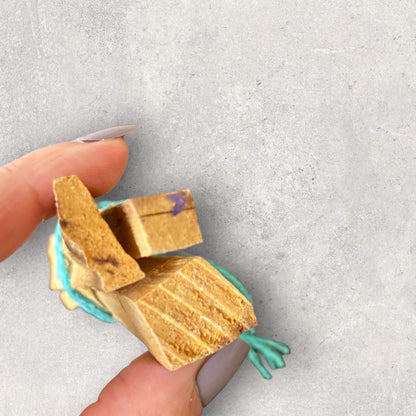 Flat lay of Palo Santo bundle with candle and journal for ritual use