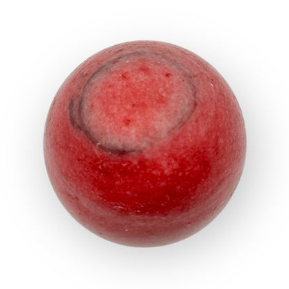 Close-up of Pink Agate egg with striking pink coloration and grounding crystal texture