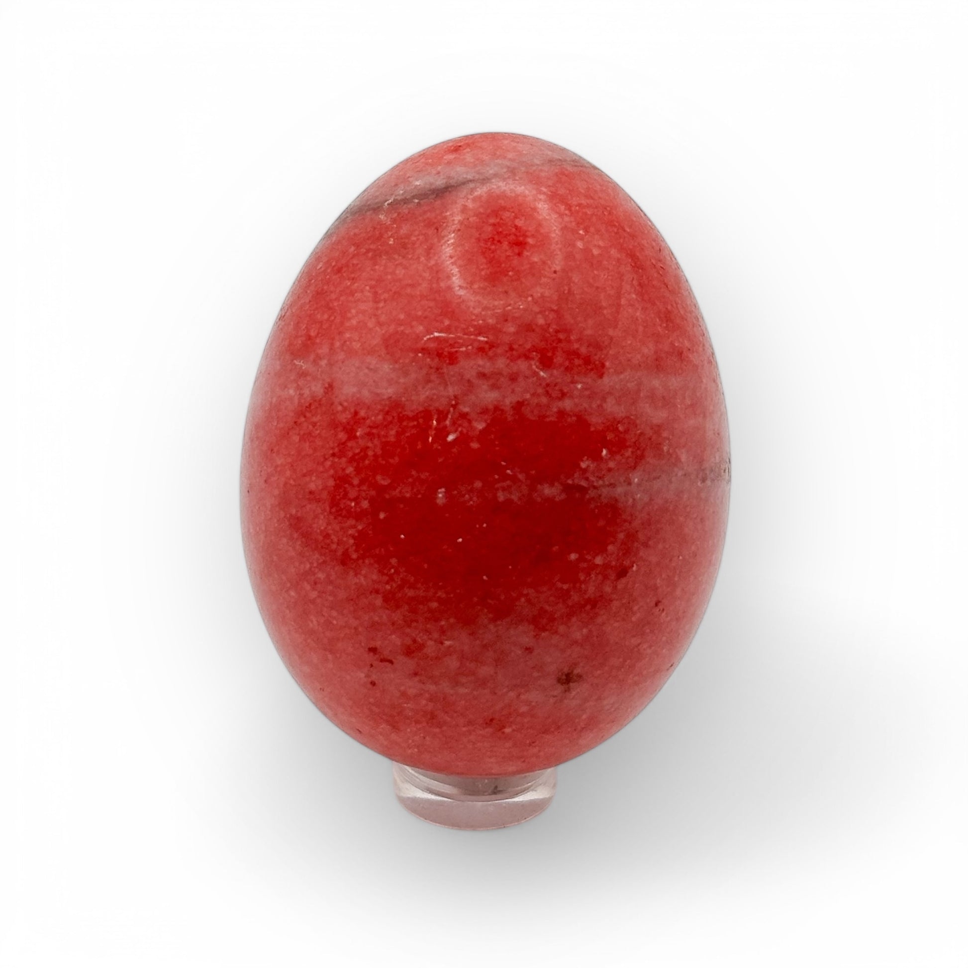 Pink Agate egg on display stand featuring rich pink tones and polished surface