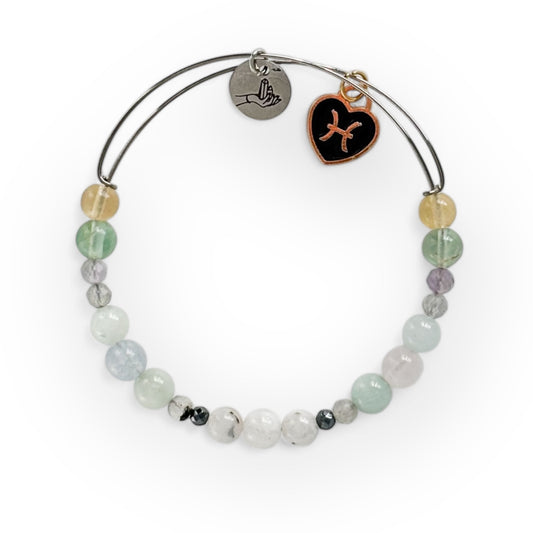 Pisces Crystal Charm Bracelet with a black charm, featuring Moonstone, Hematite, Labradorite, Aquamarine, Rose Quartz, Amethyst, and Fluorite for protection and emotional clarity.