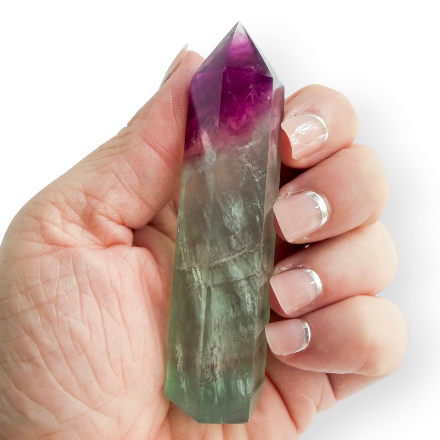 3.2 oz purple and green Fluorite obelisk held in hand
