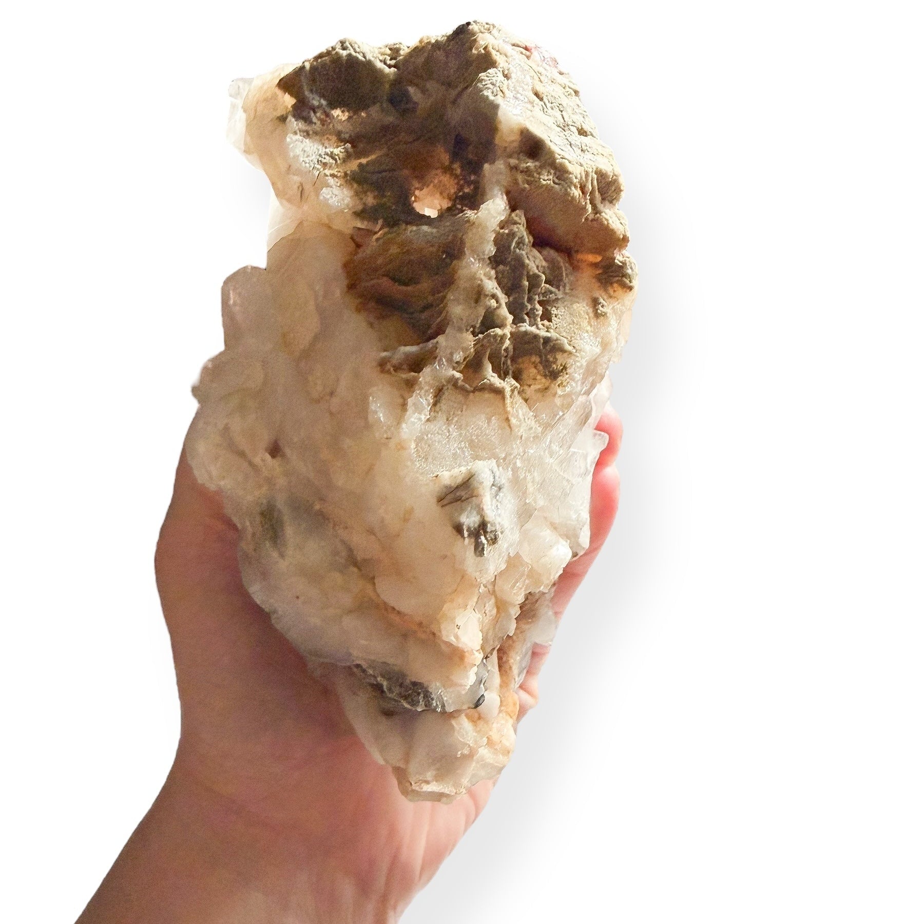 Back view showing earthy matrix of Quartz Cluster in hand