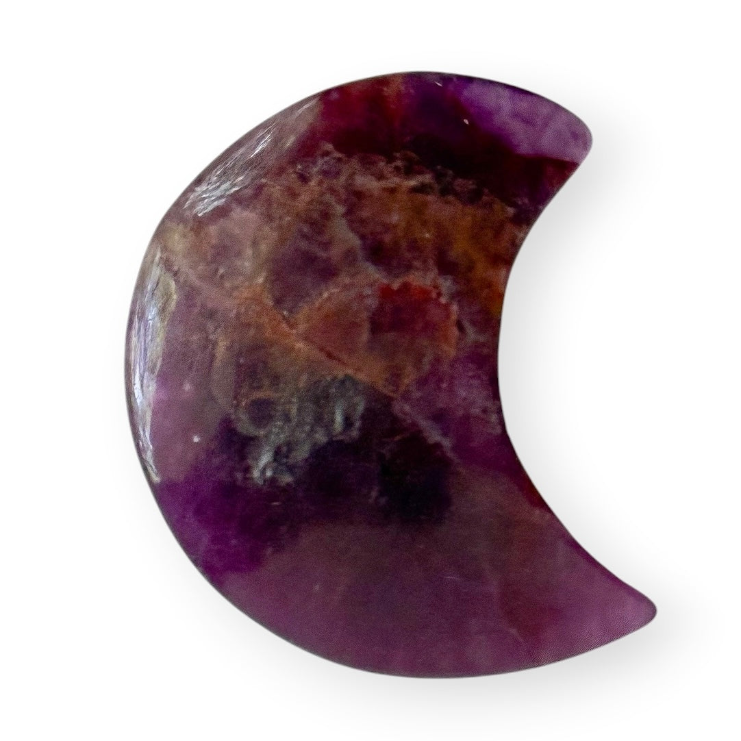 Rainbow fluorite crescent moon crystal carving featuring natural shades of purple, lavender, and translucent fluorite.
