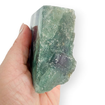 Bottom view of a Rainbow Fluorite freeform with polished face and natural rough edges.
