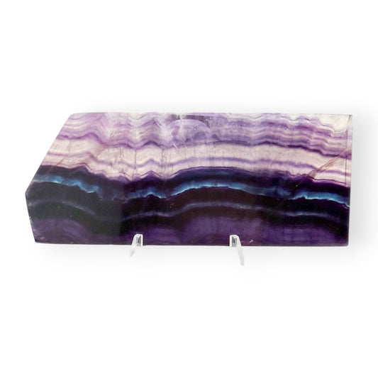 Polished Rainbow Fluorite slab featuring deep purple, blue, and lavender natural banding