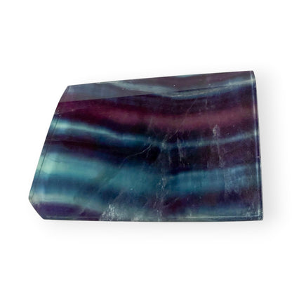 Rainbow Fluorite slab with natural purple, blue, teal, and aqua banding polished to a glossy finish.