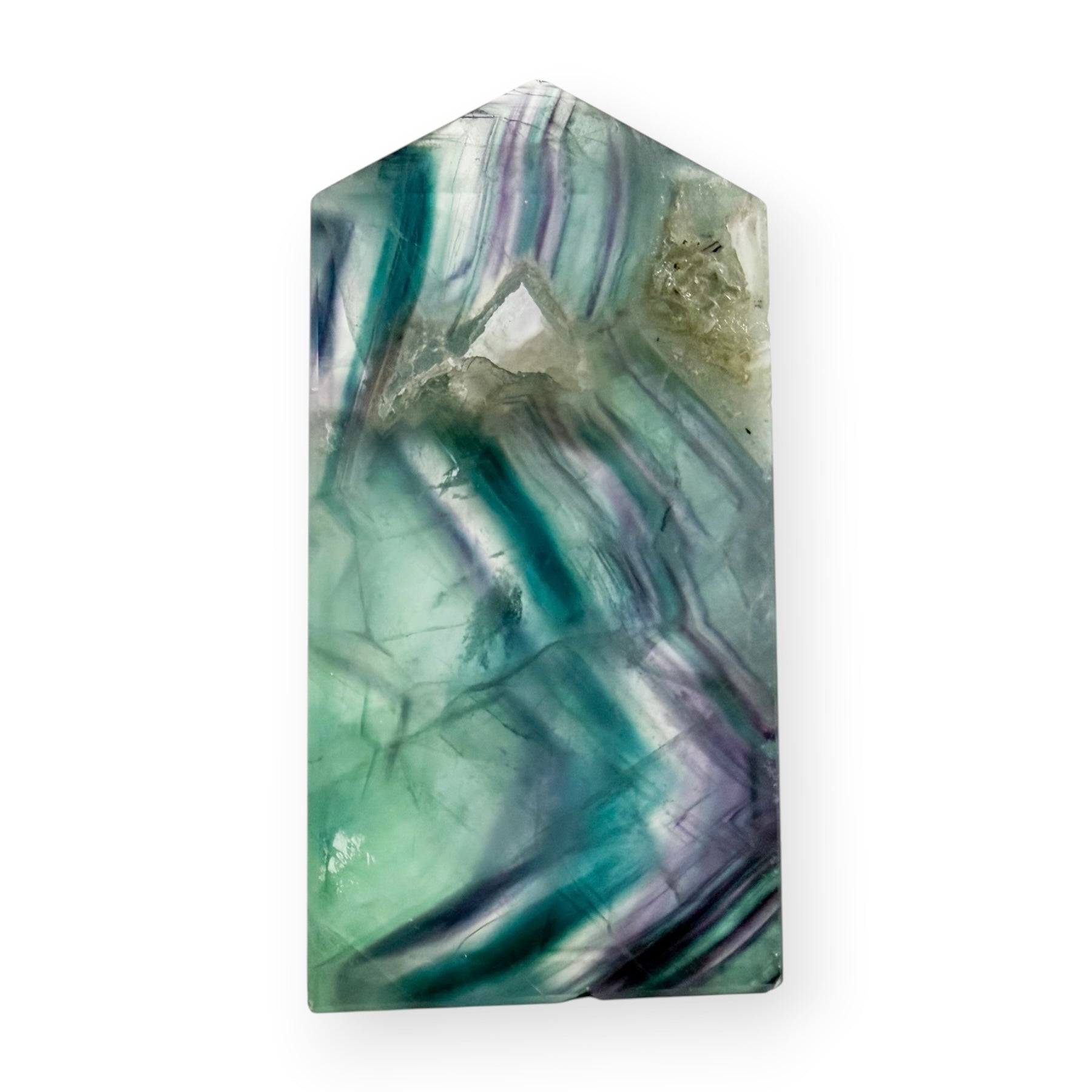 Rainbow Fluorite tower featuring green, teal, purple, and clear banding with natural internal formations and a druzy pocket near the top.