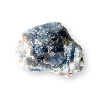 Raw Blue Calcite stone on white background for product display.