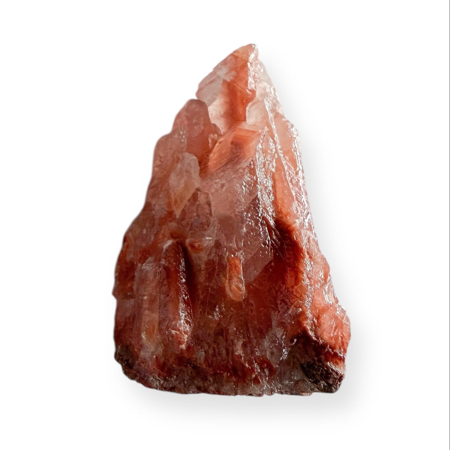 Raw Red Calcite crystal with warm red and peach tones