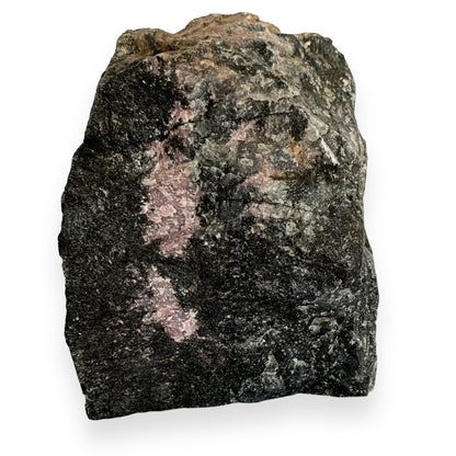 Back view of Rhodonite crystal with natural raw black surface