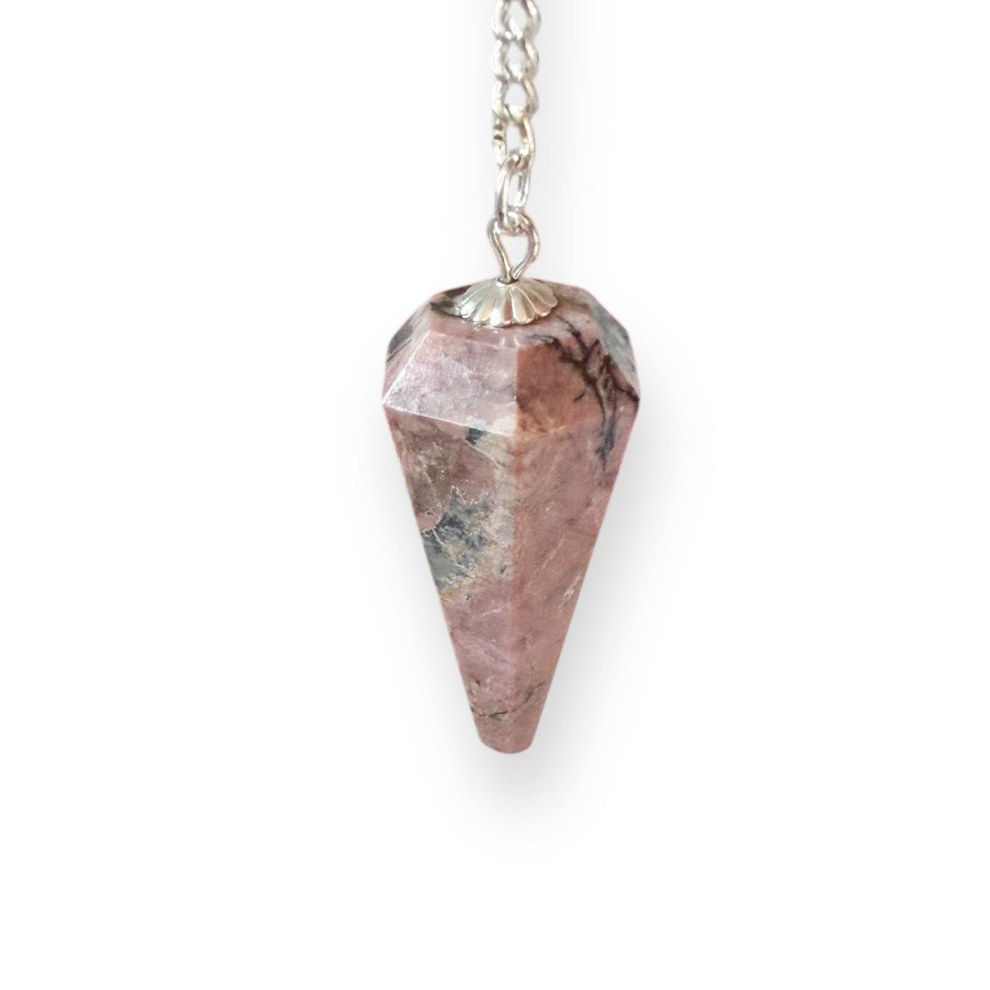 Faceted rhodonite crystal pendulum with silver chain on white background