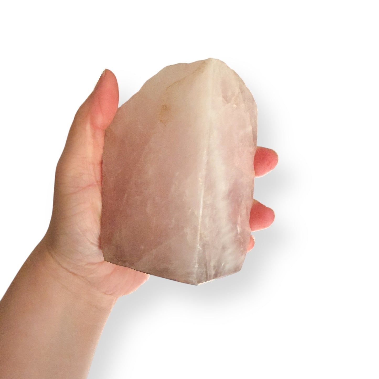 Rose Quartz bookend shown in hand for size reference.