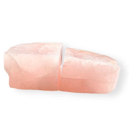 Matching pair of Rose Quartz bookends cut from the same stone, soft layered blush color.