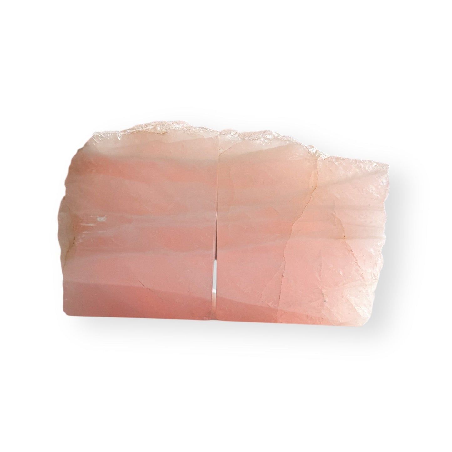 Pair of rose quartz bookends with polished front and natural matte back, soft pink crystal home decor.