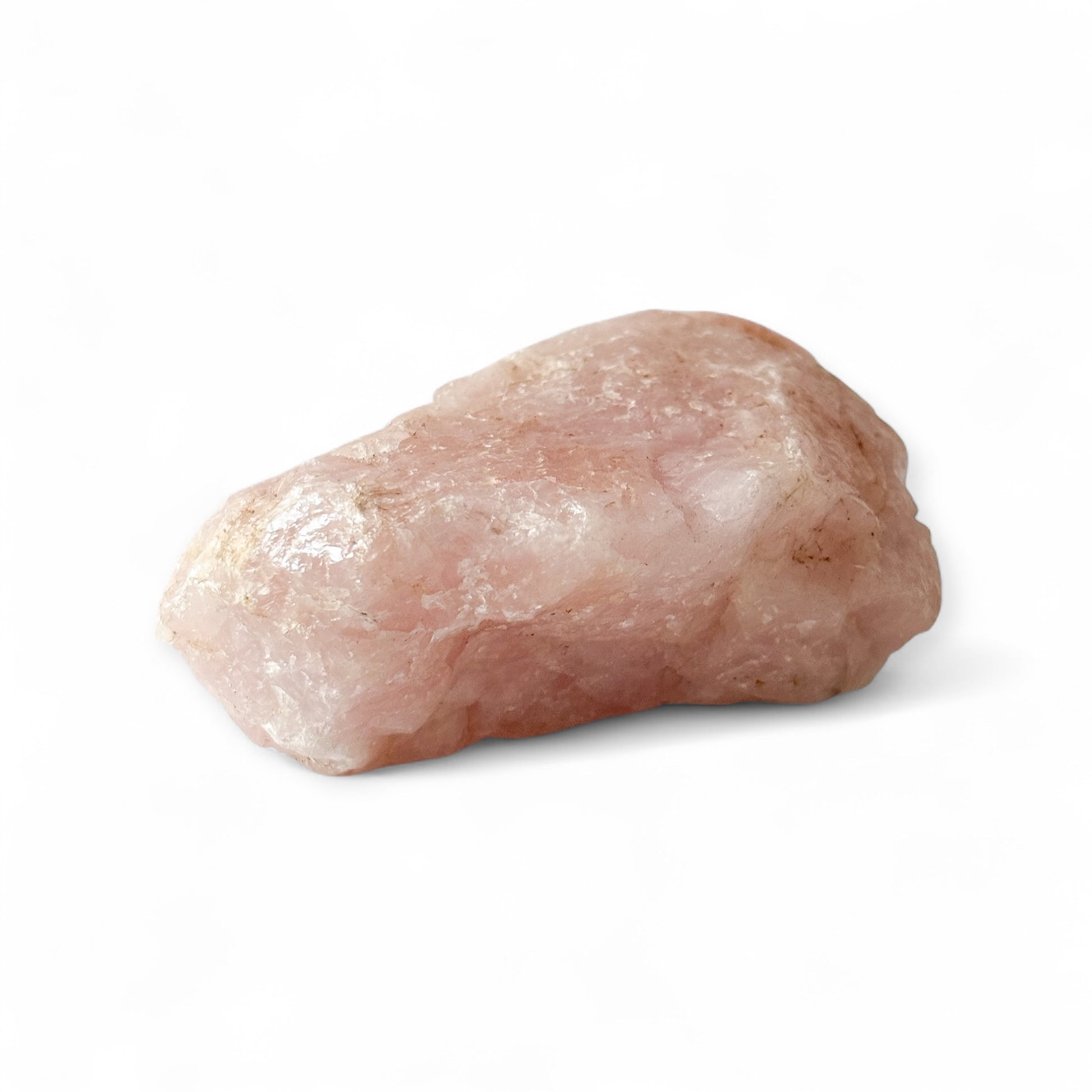 Large rough Rose Quartz with soft pink coloring and raw texture