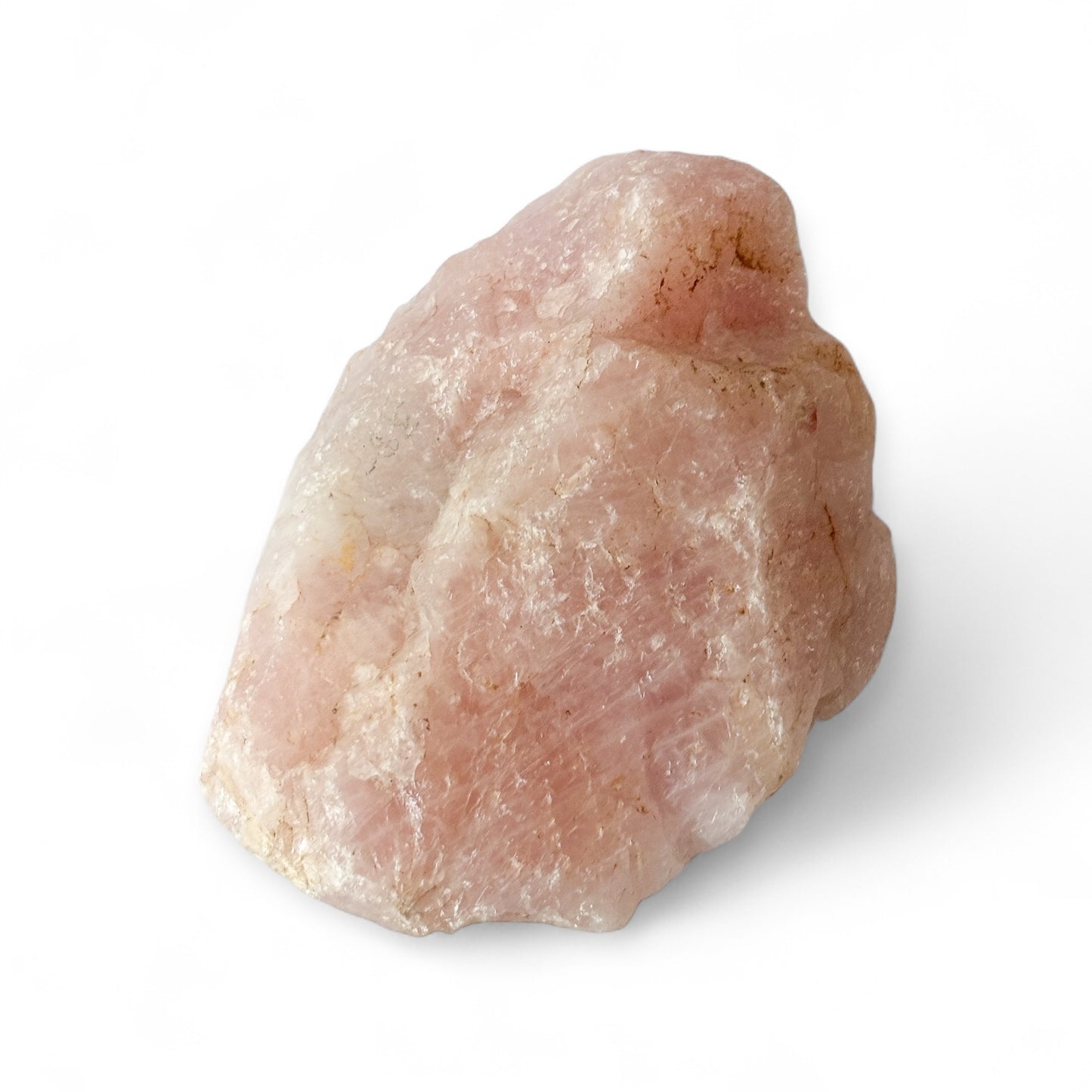 Side angle of large Rose Quartz crystal showing natural edges and shimmer